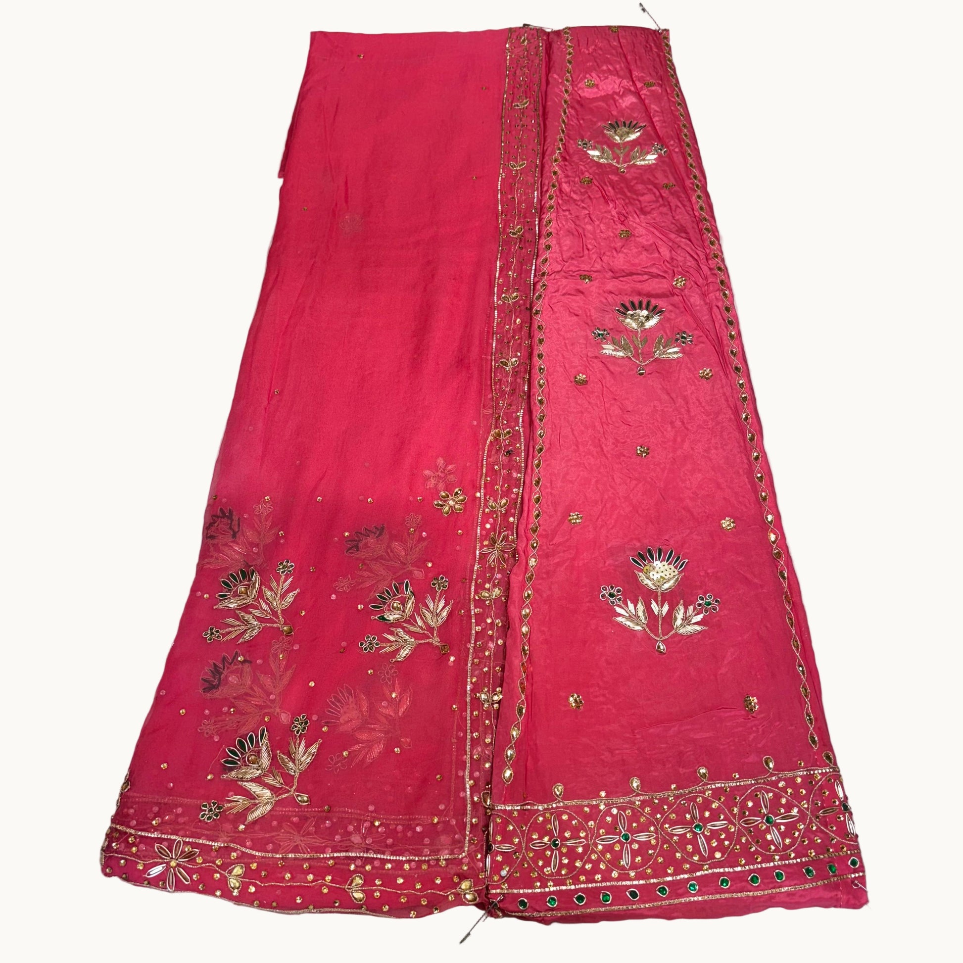 Red embroidered fabric on a light gray background