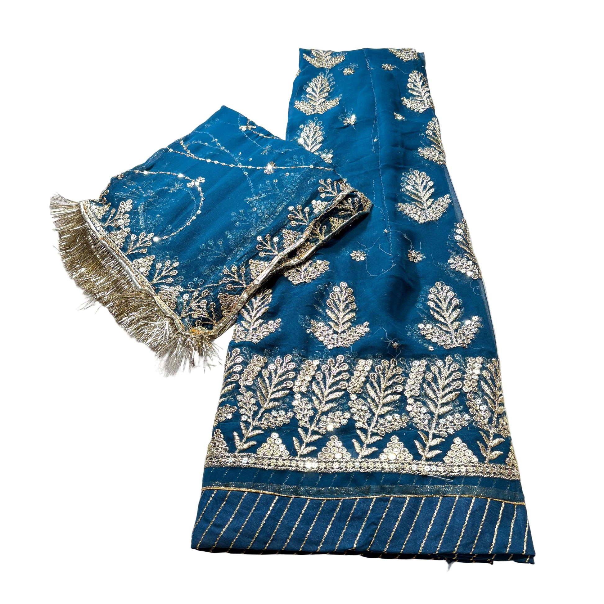 Blue fabric with white embroidery on a light gray background