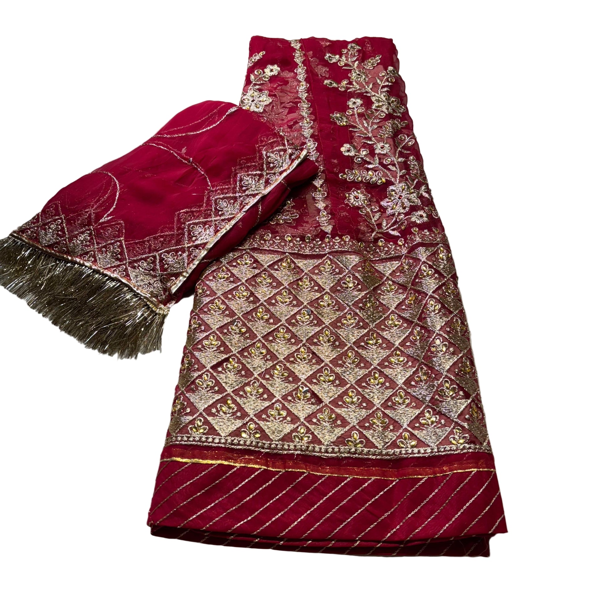 Red embroidered fabric with gold patterns on a light gray background