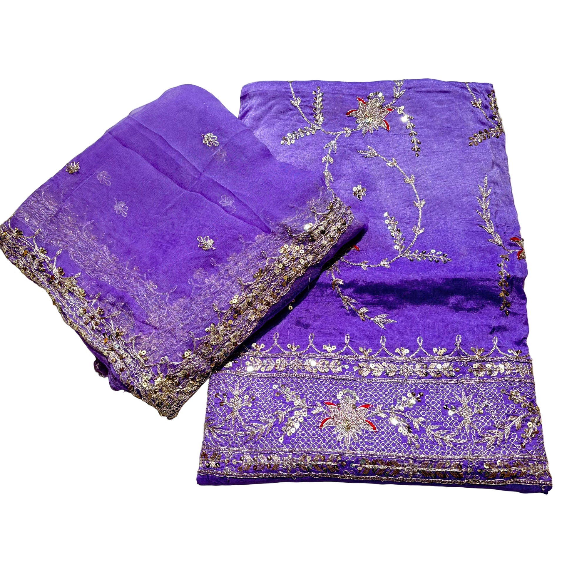 Purple fabric with intricate gold embroidery on a light gray background