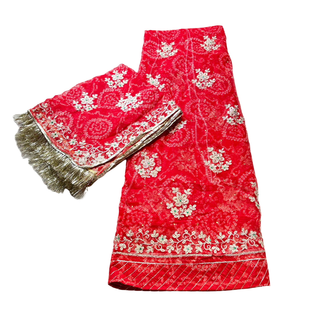 Pink embroidered fabric with gold patterns on a light gray background