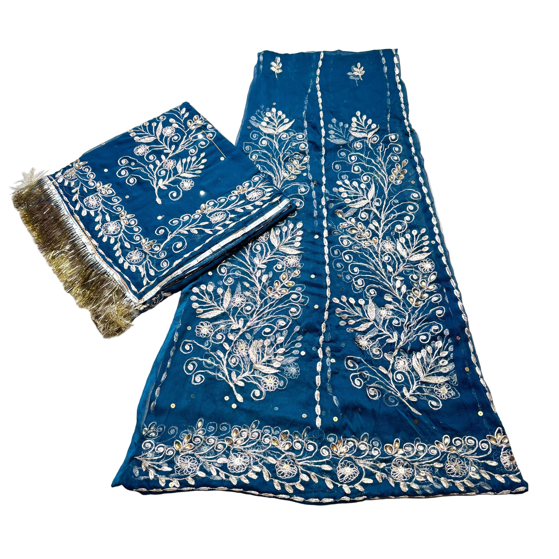 Blue fabric with white floral patterns on a light gray background