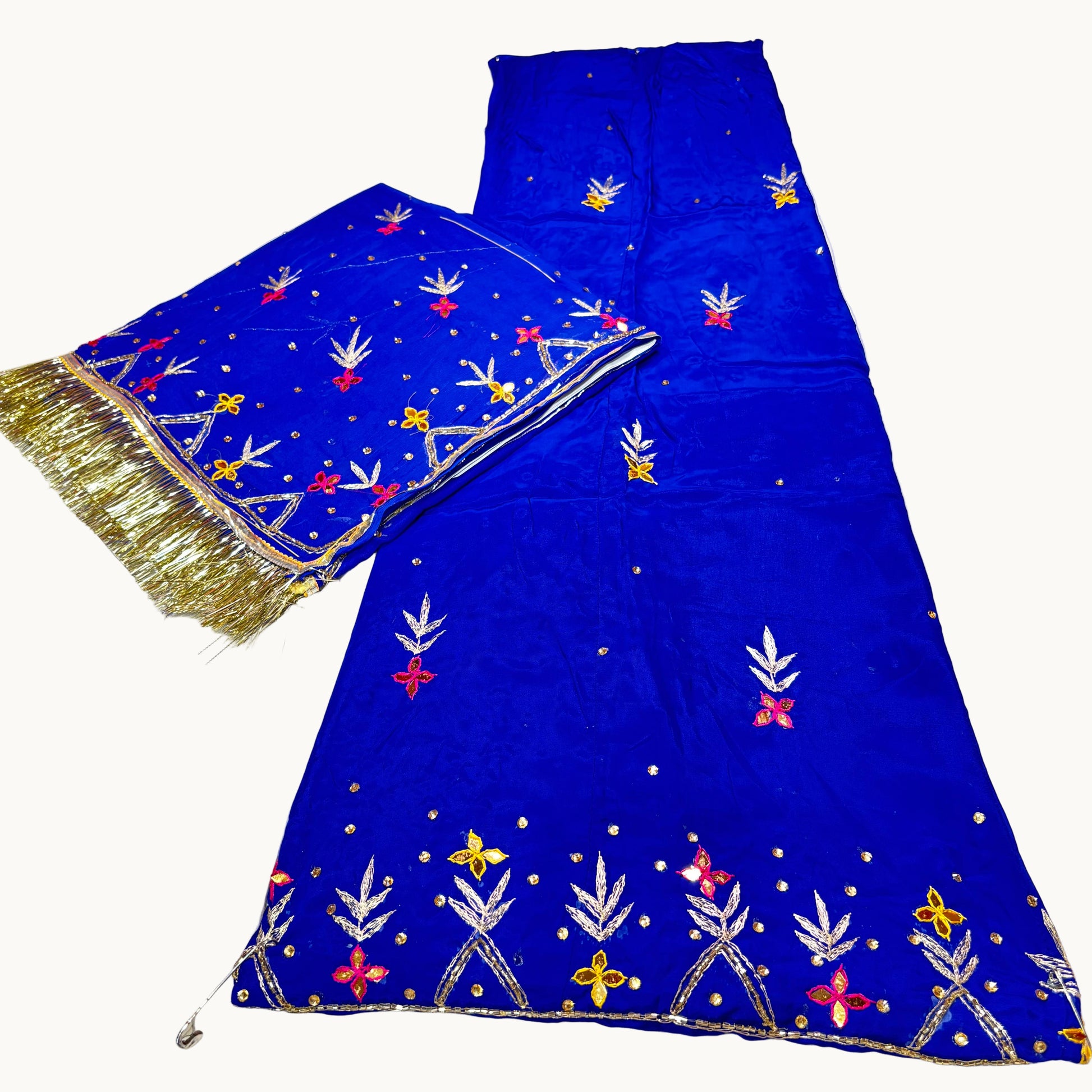 Blue embroidered fabric with gold and multicolor patterns on a white background