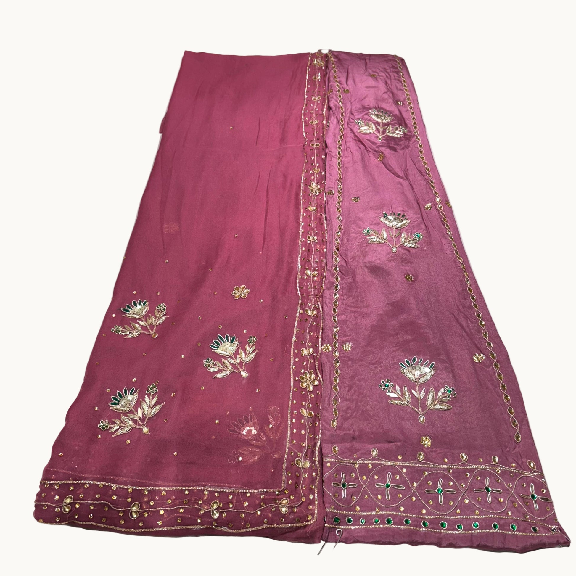 Purple embroidered fabric on a white background