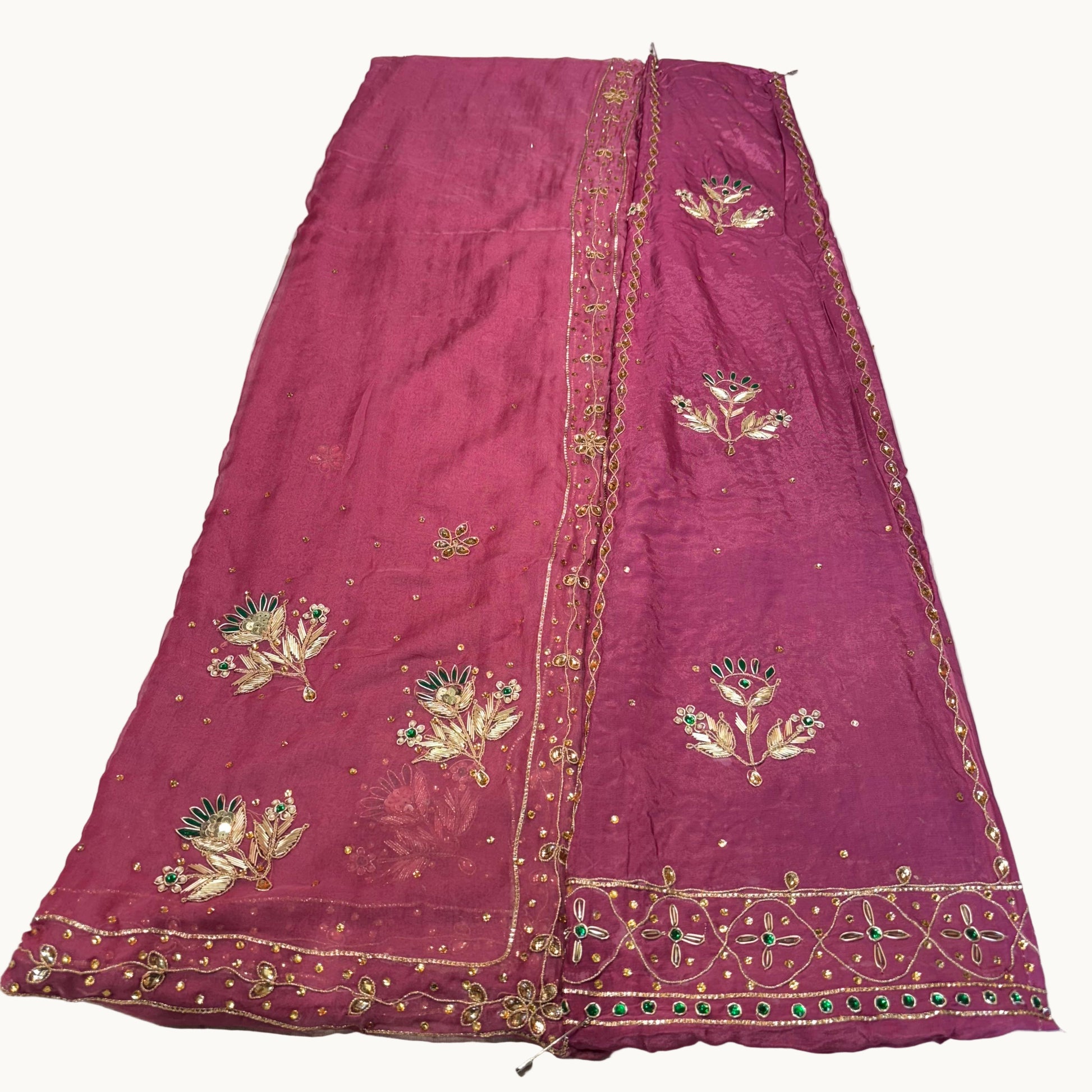 Purple embroidered fabric on a white background