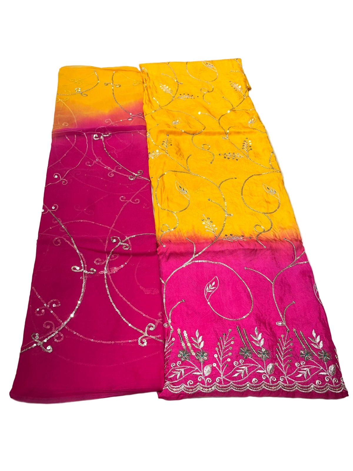 Saree with pink and yellow design on a white surface