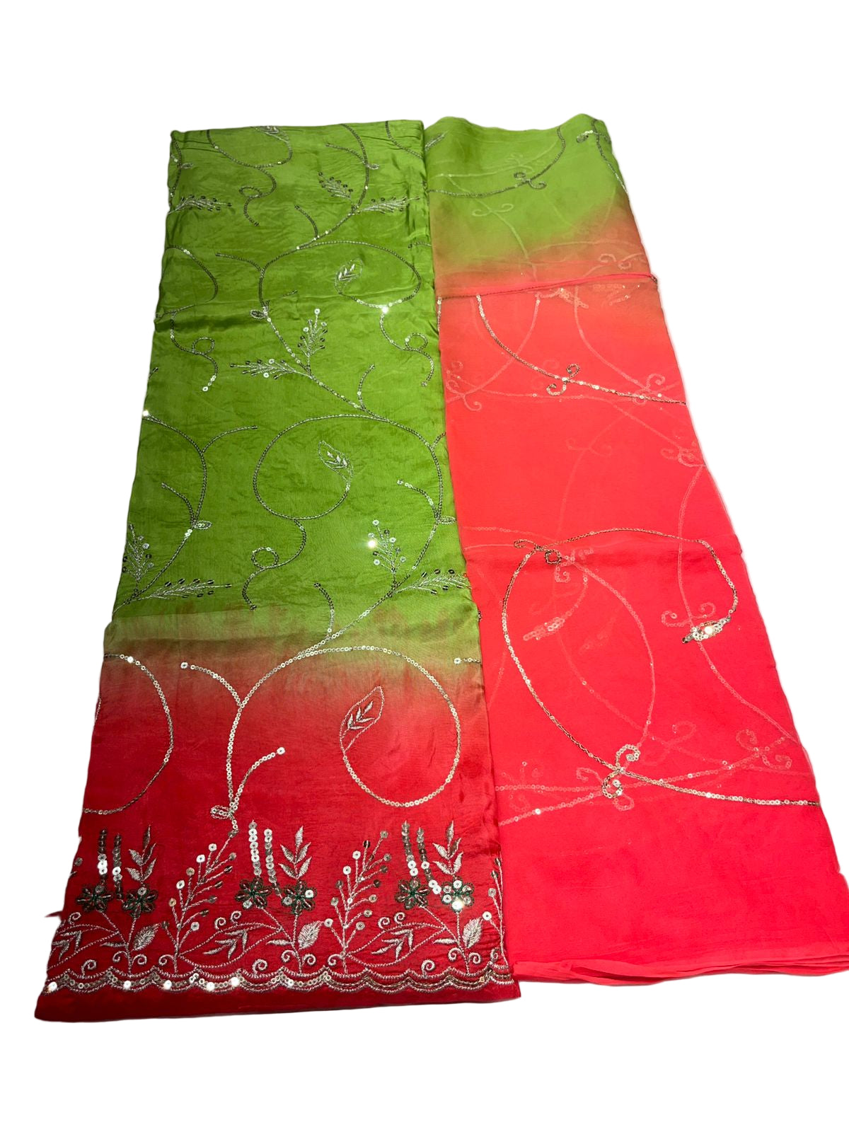 Green and red fabric with floral patterns on a white background