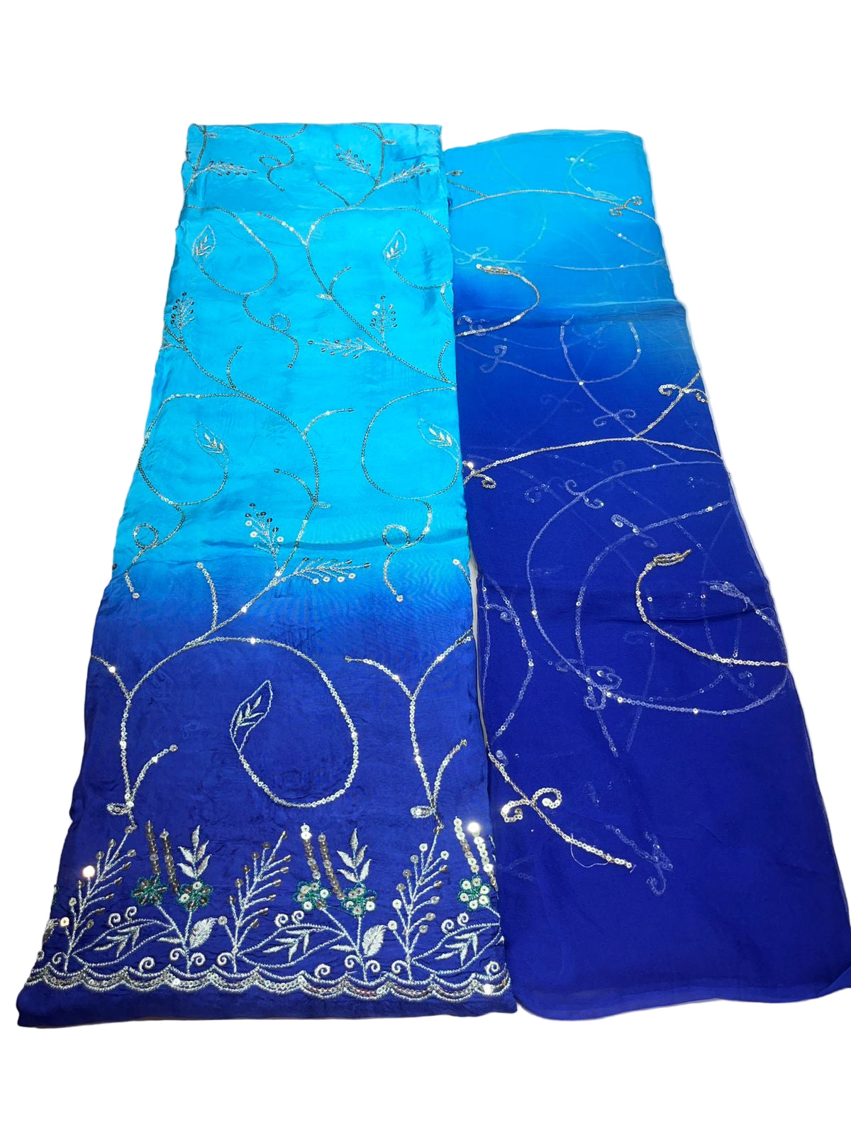 Blue fabric with white embroidery on a white background