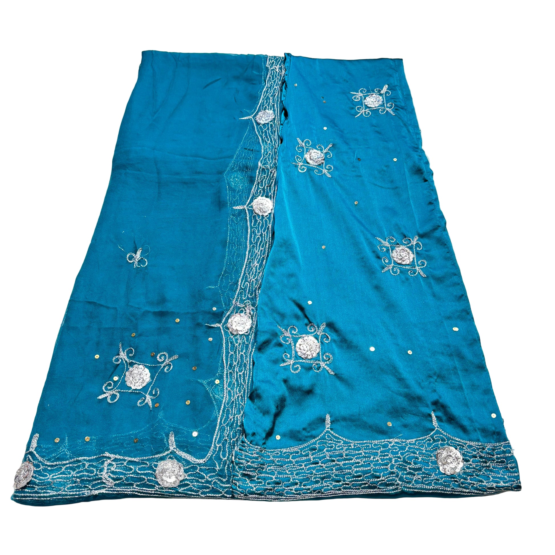 Blue embroidered fabric on a light gray background