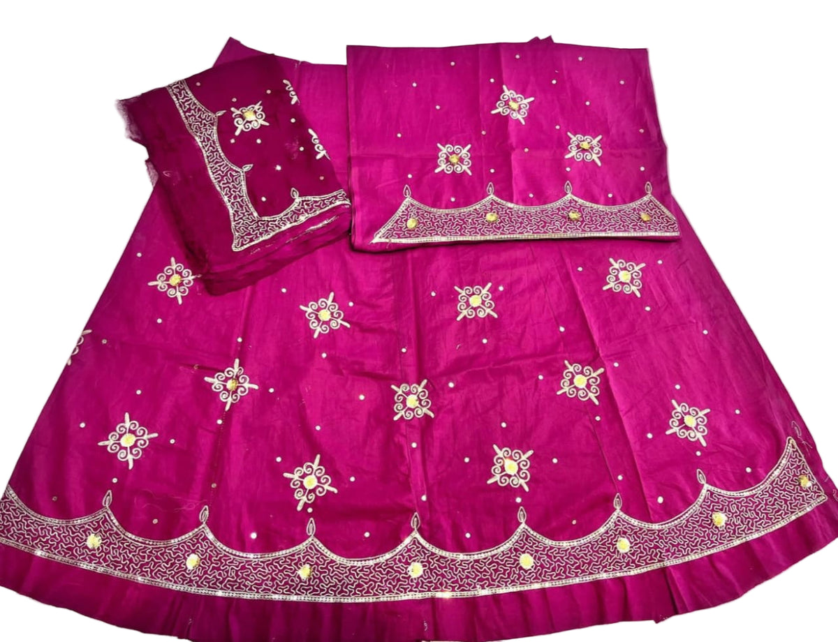 Pink traditional outfit with intricate embroidery on a white background
