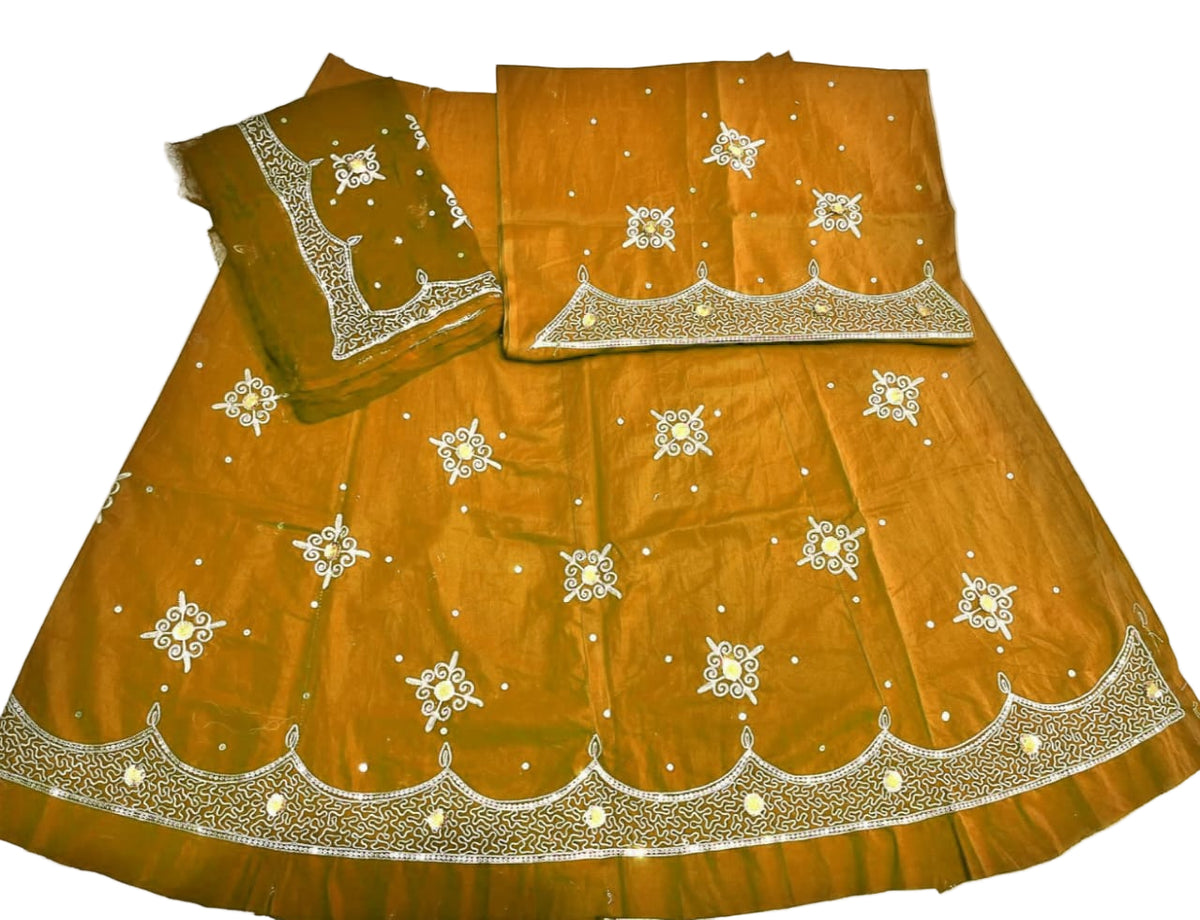 Orange traditional outfit with intricate white embroidery on a white background