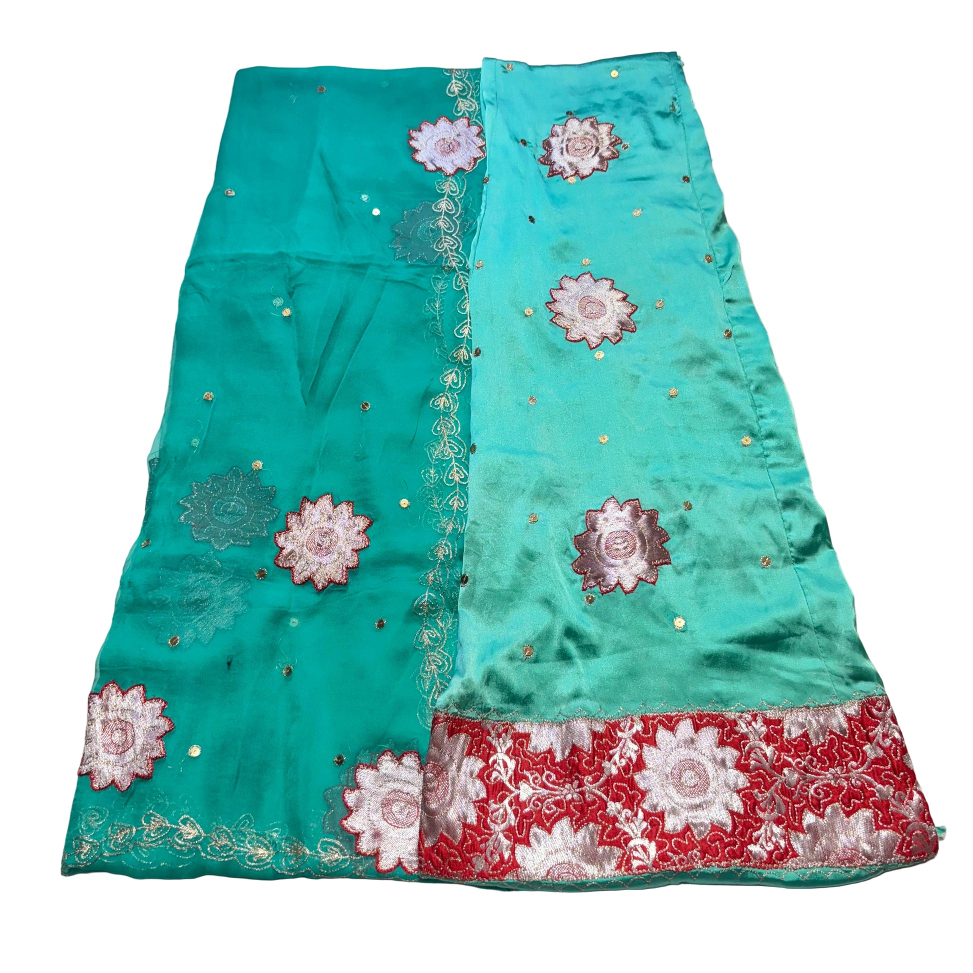 Turquoise fabric with floral embroidery on a light gray background