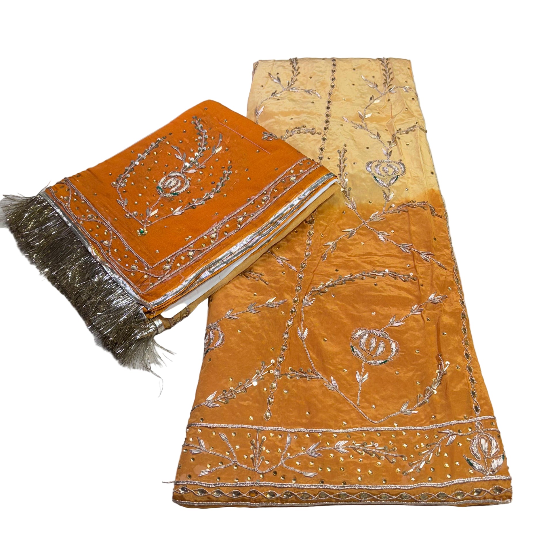 Two orange fabric items with silver embroidery on a white background