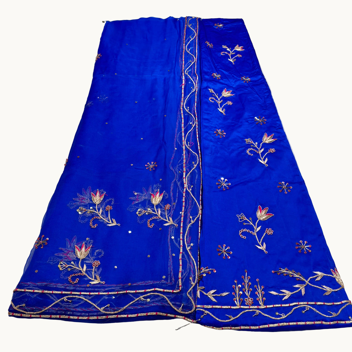 Blue embroidered fabric on a white background