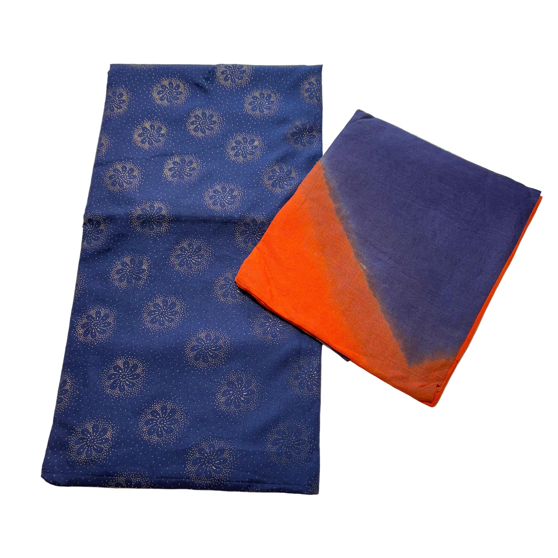 Two blue fabric items with different patterns on a light gray background