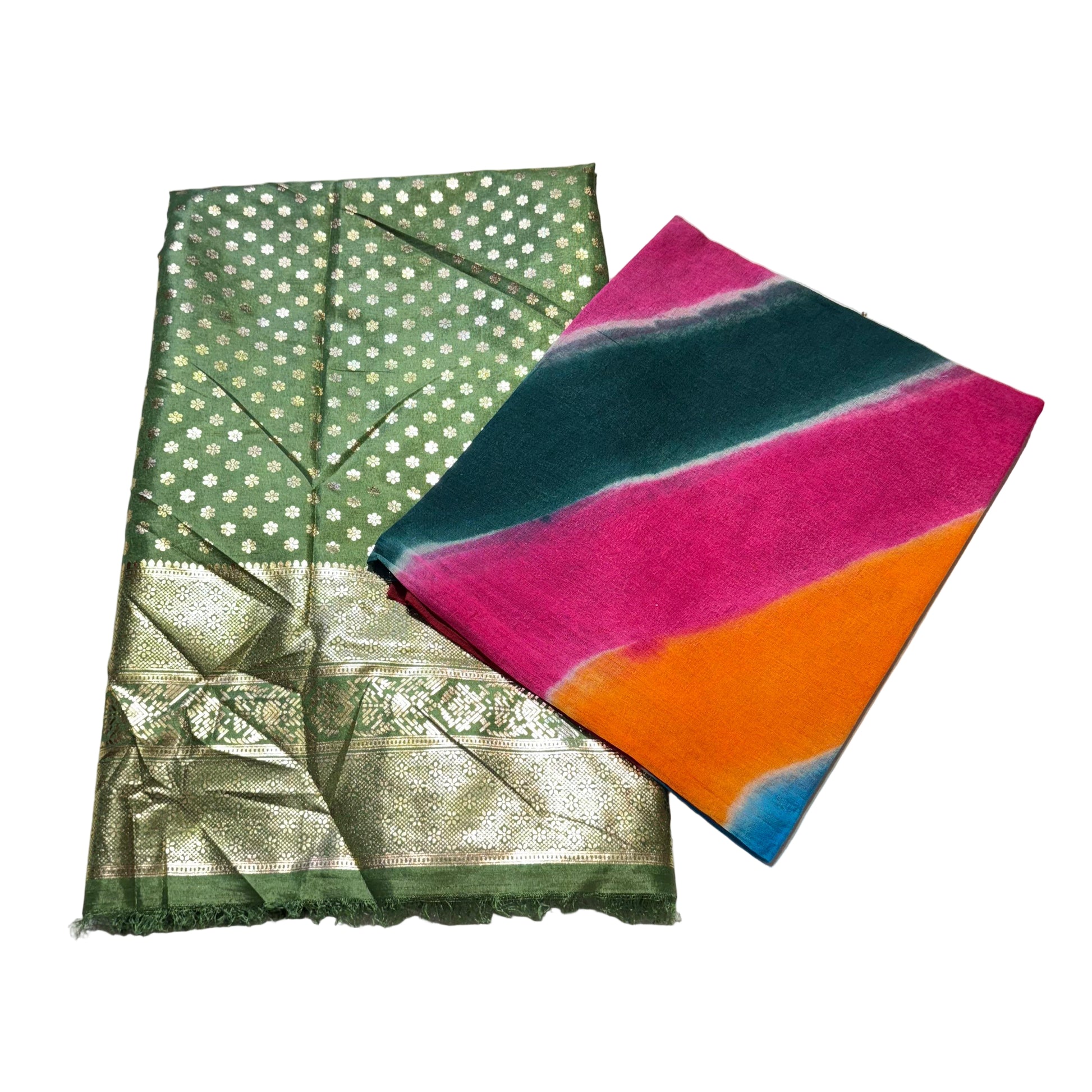 Two scarves, one green with white patterns and the other multicolored, on a light gray surface.