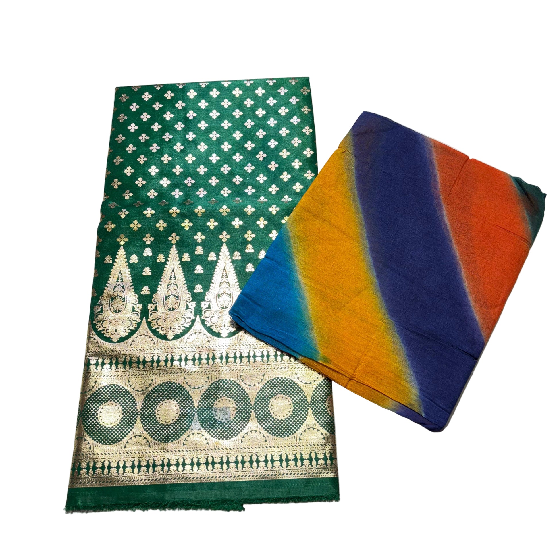 Green fabric with gold patterns and a tie-dye fabric on a light gray surface