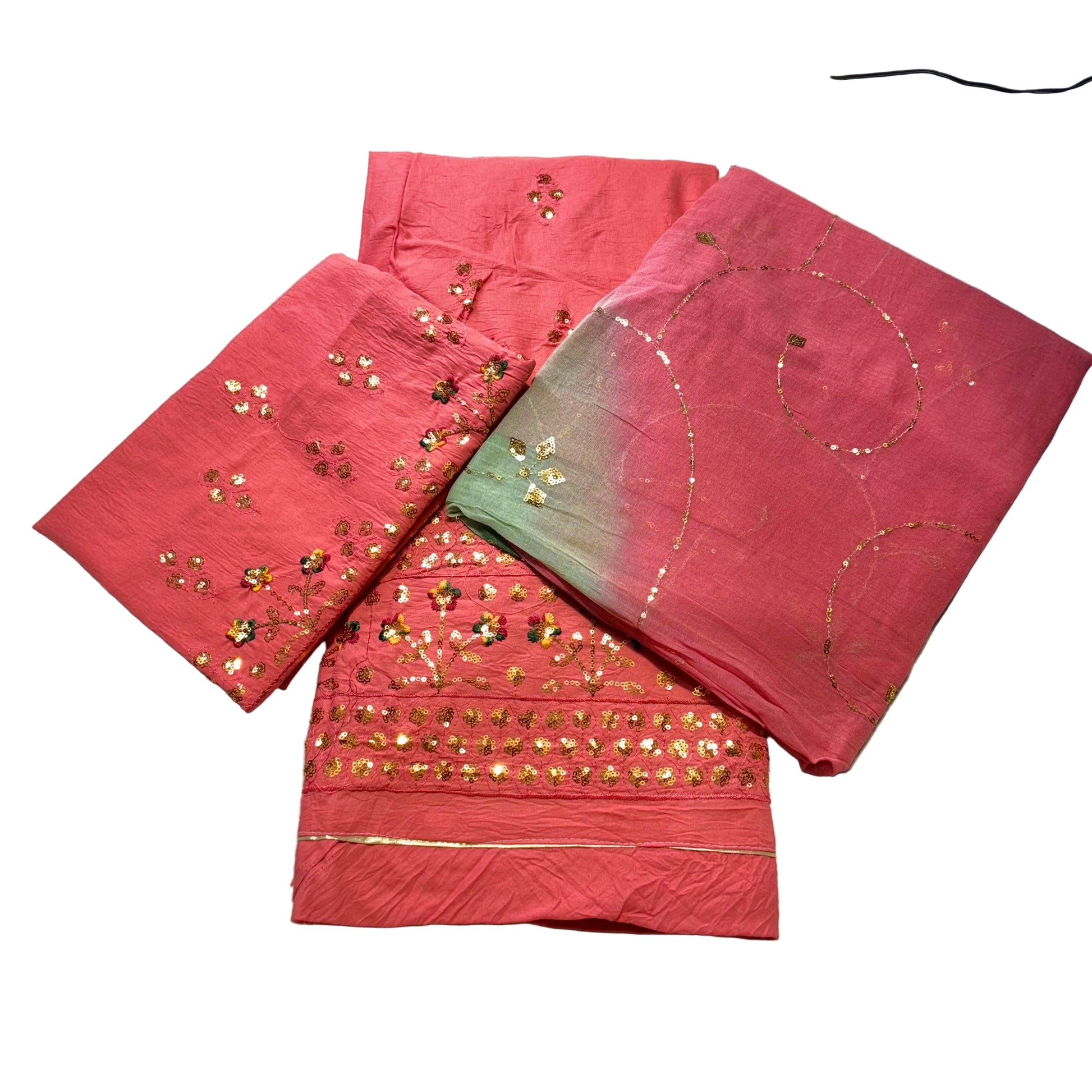 Red fabric with gold embroidery on a light gray background