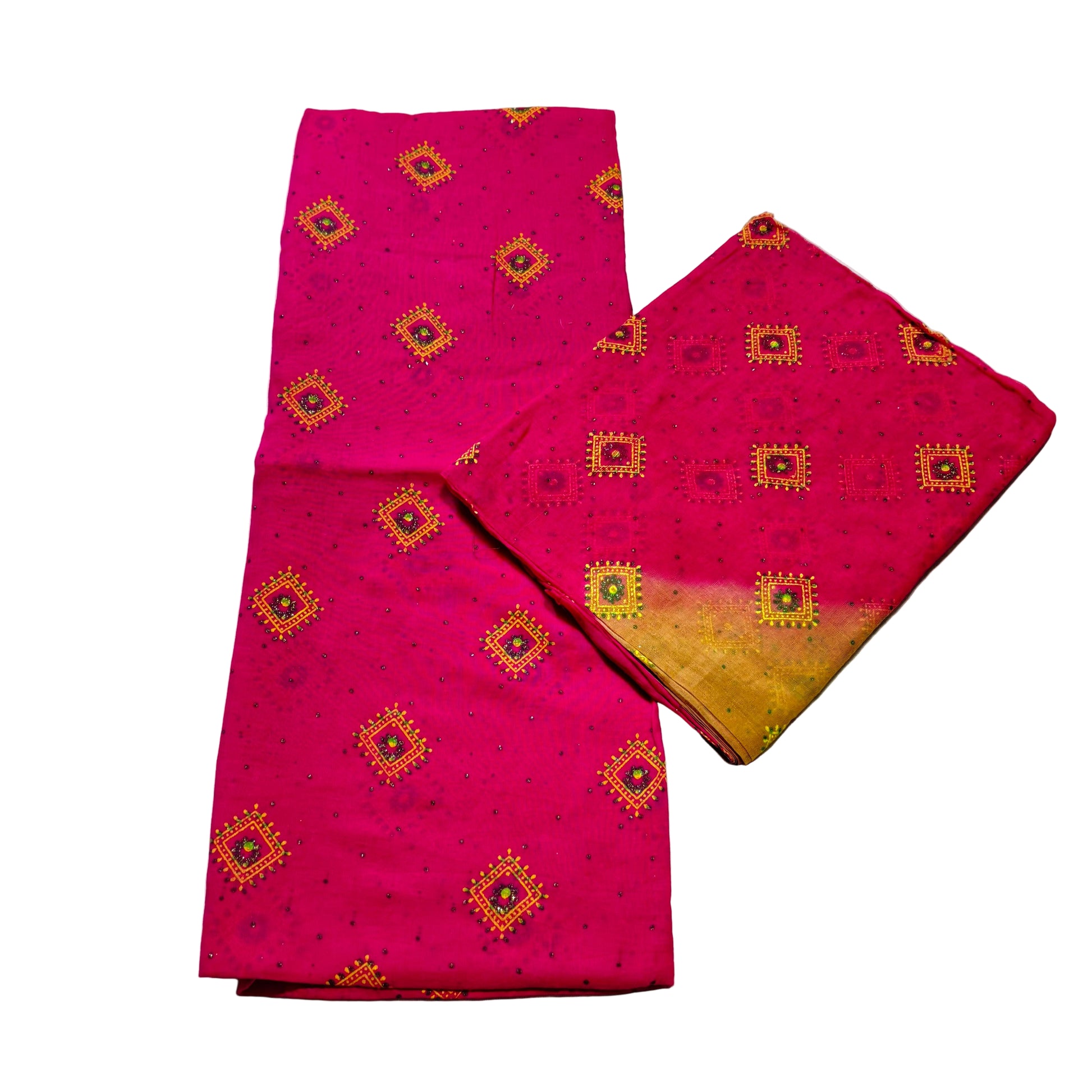 Two pink fabric pieces with yellow patterns on a white surface