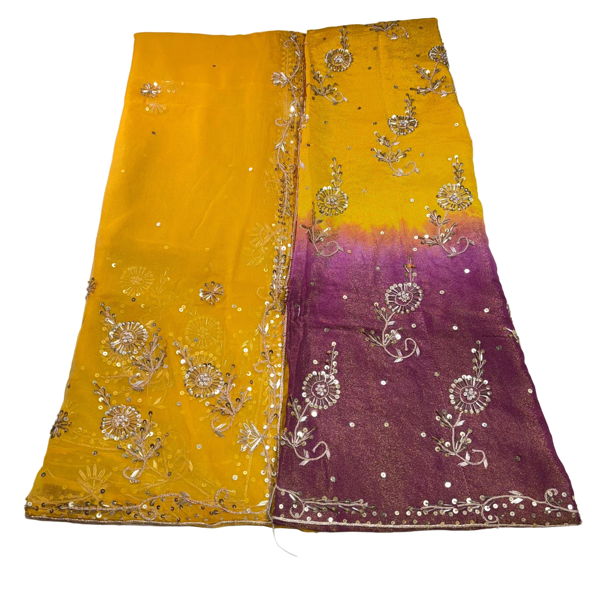Yellow and purple fabric with floral embroidery on a white background