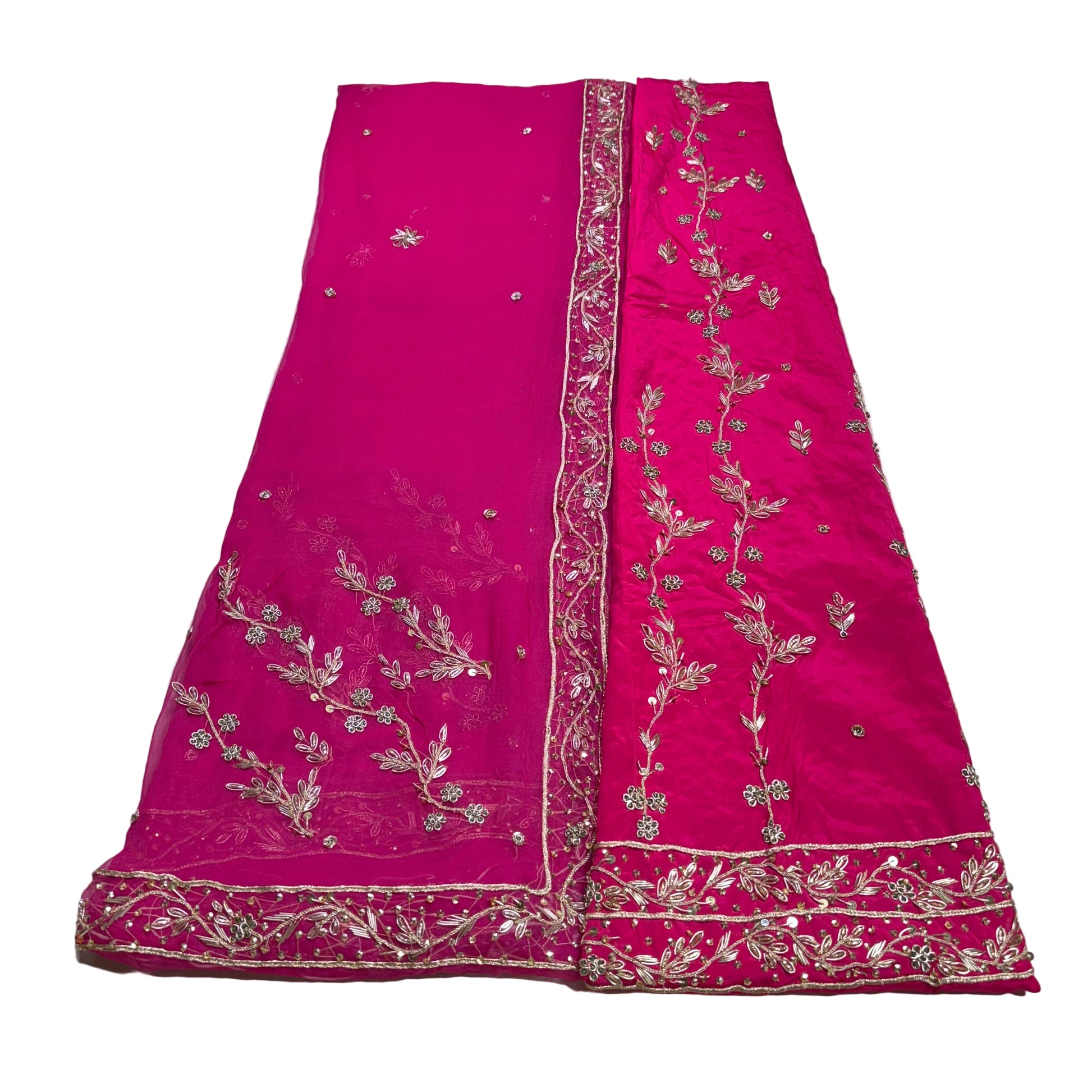 Pink fabric with gold embroidery on a white background