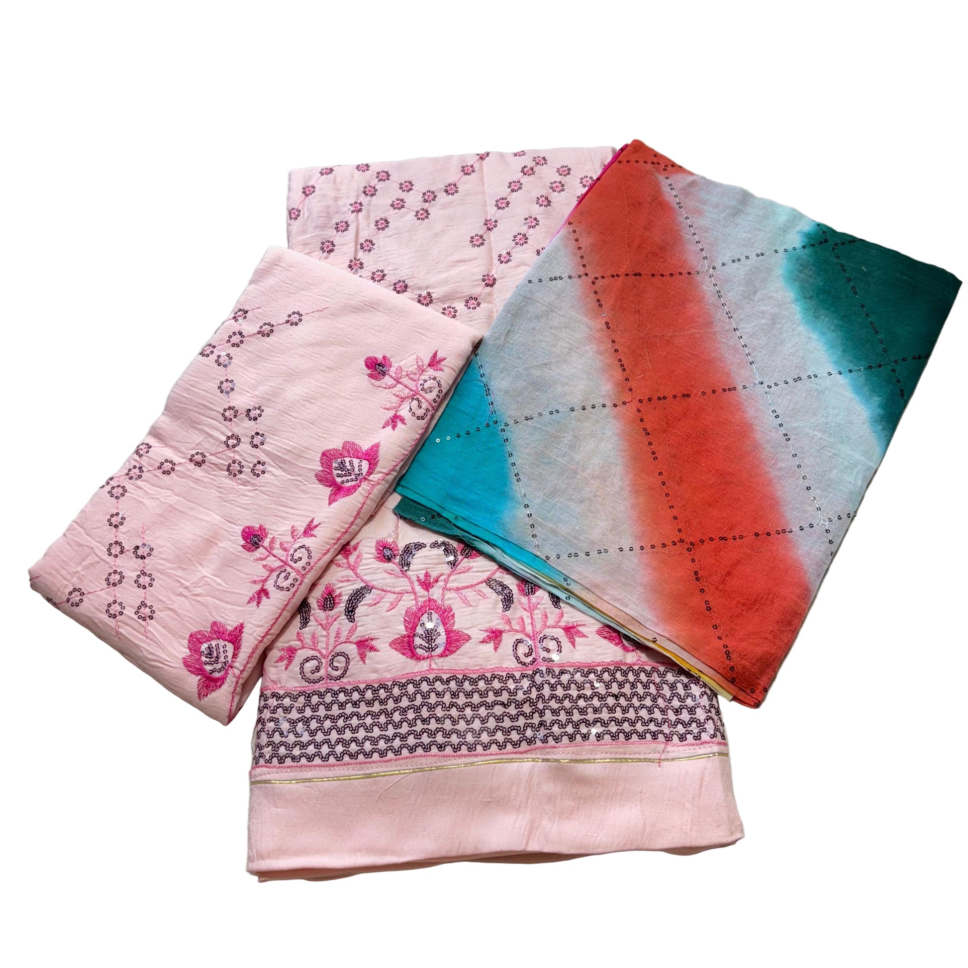 Two folded fabric pieces on a light gray surface, one pink with floral patterns and the other multicolored.