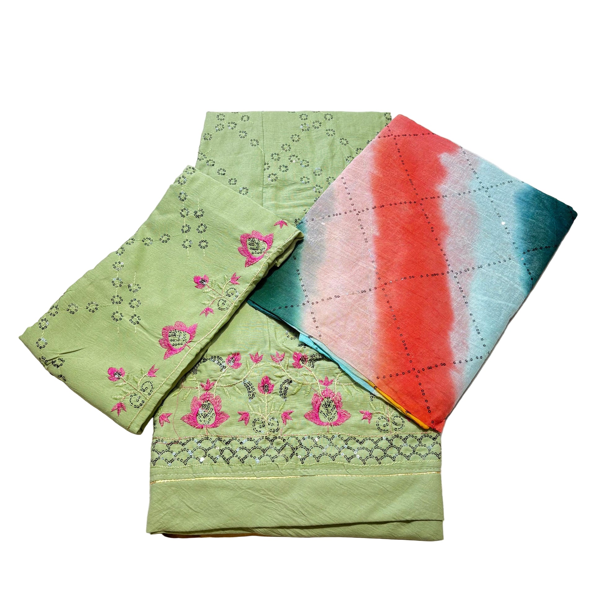 Green fabric with pink floral patterns on a white surface