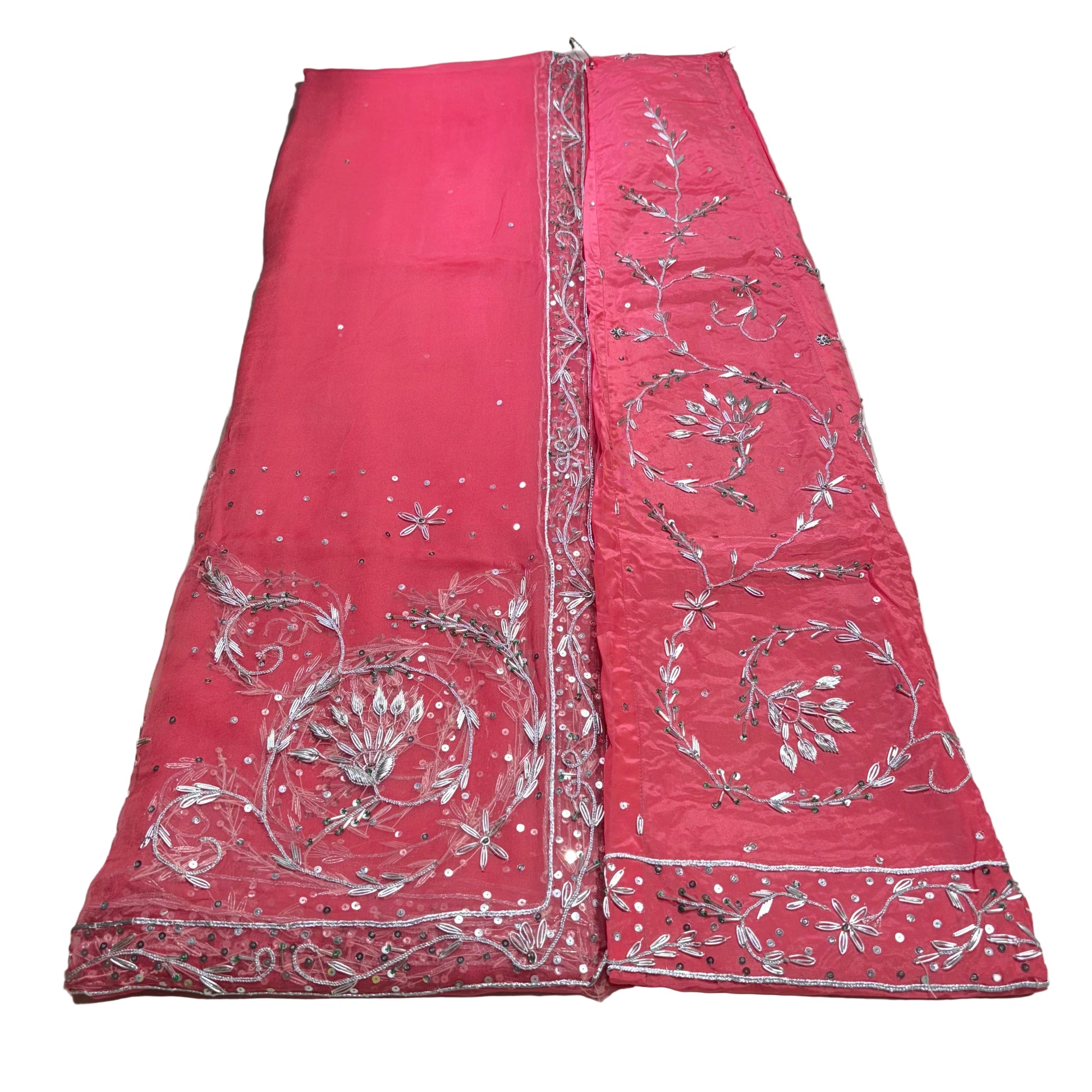 Red fabric with silver embroidery on a white background