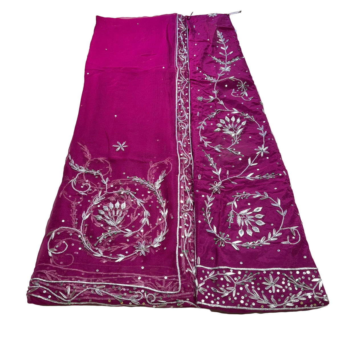 Purple embroidered fabric on a light beige surface