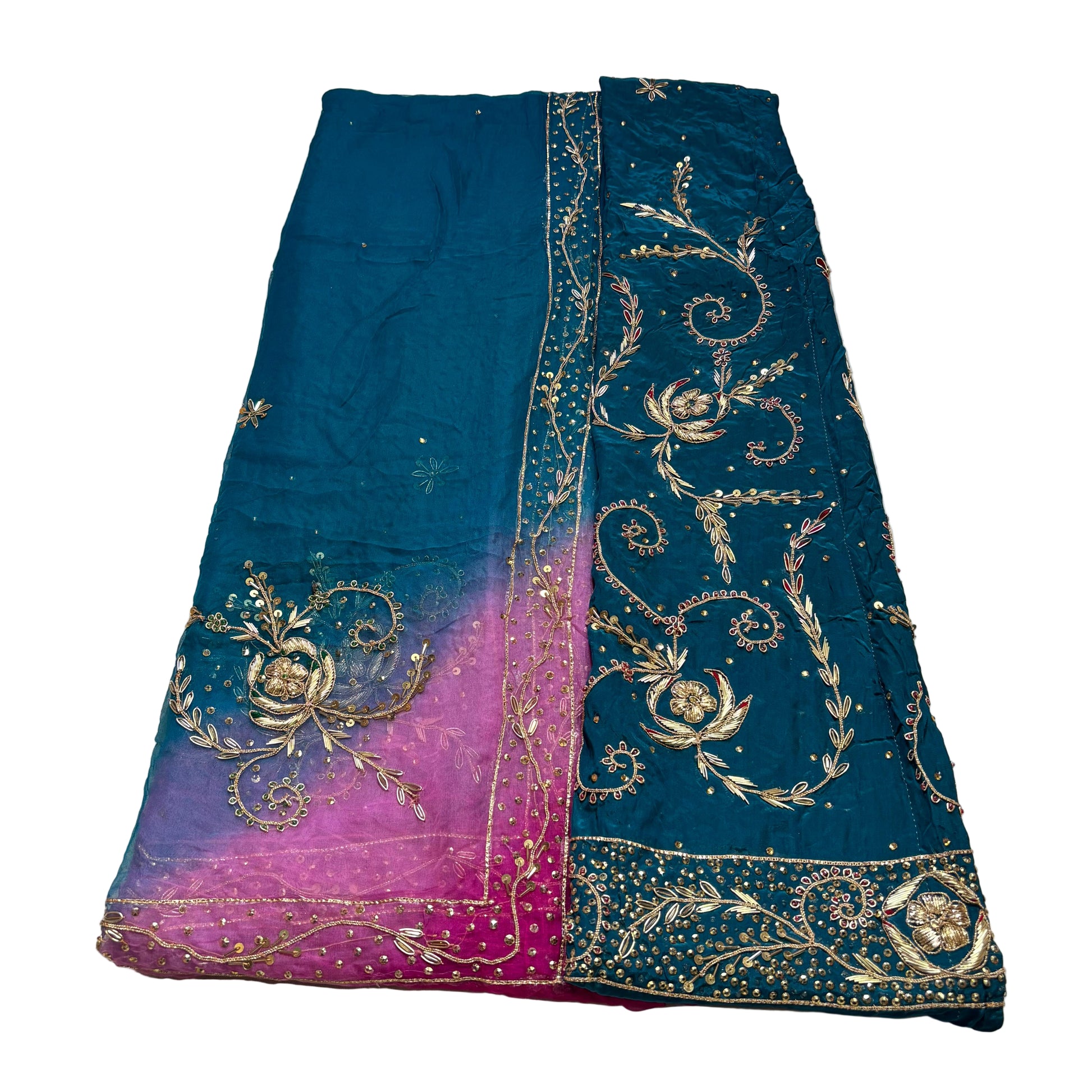 Blue and purple fabric with gold embroidery on a light gray background