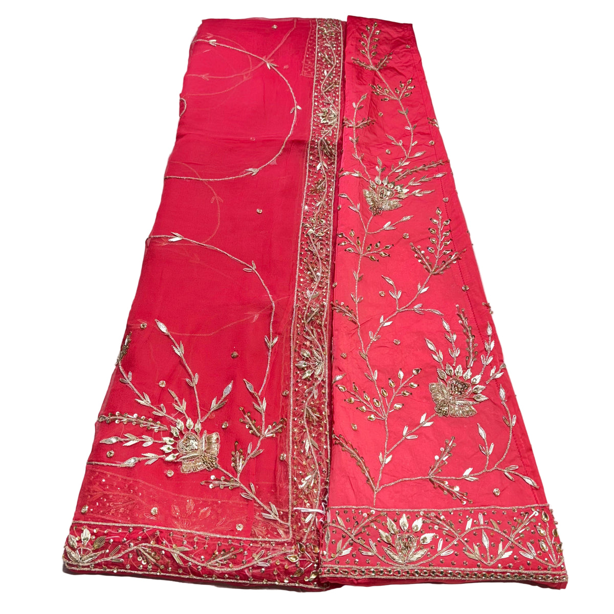 Red embroidered fabric with gold and silver patterns on a white background