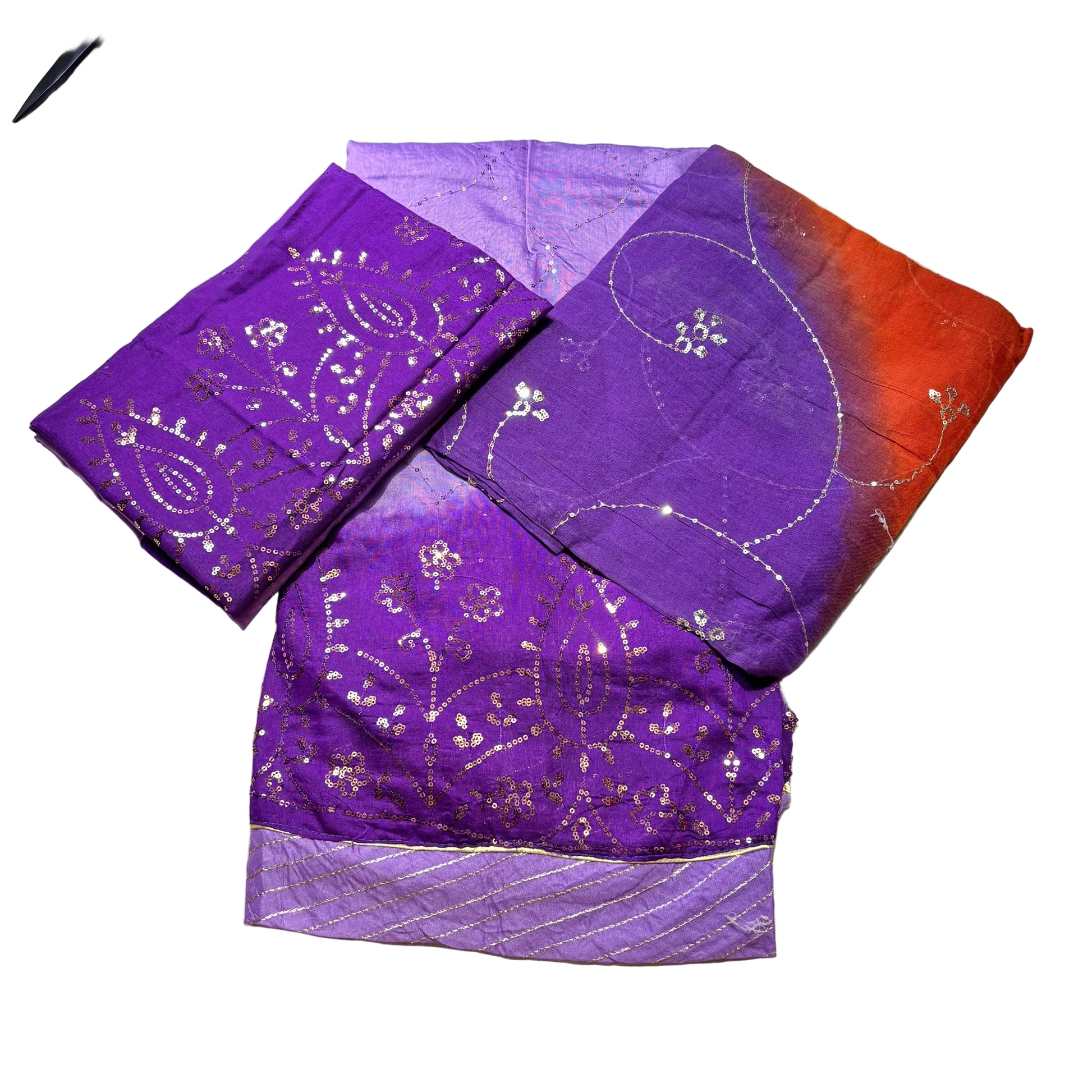 Purple fabric with gold patterns on a light gray background