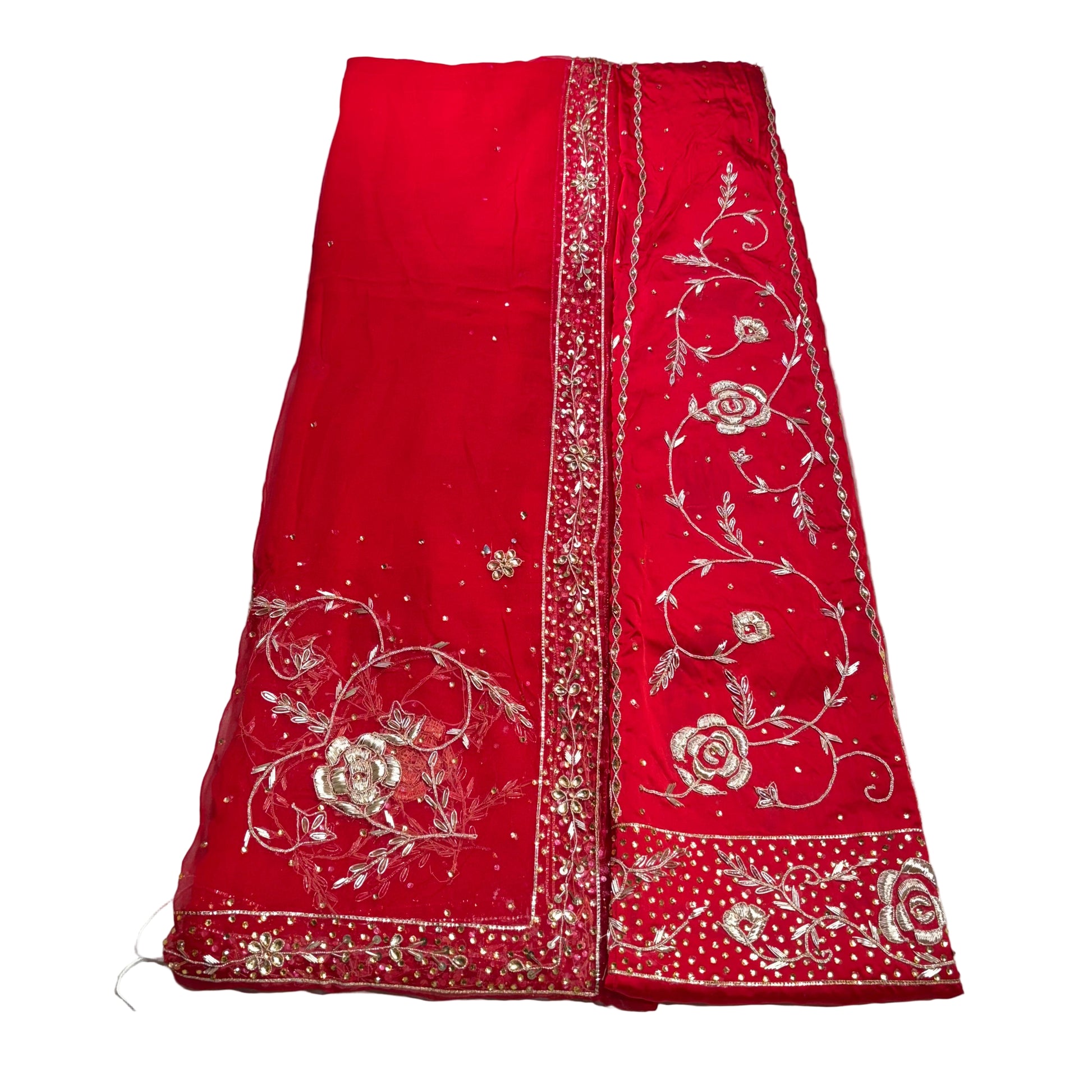 Red fabric with white floral embroidery on a white background