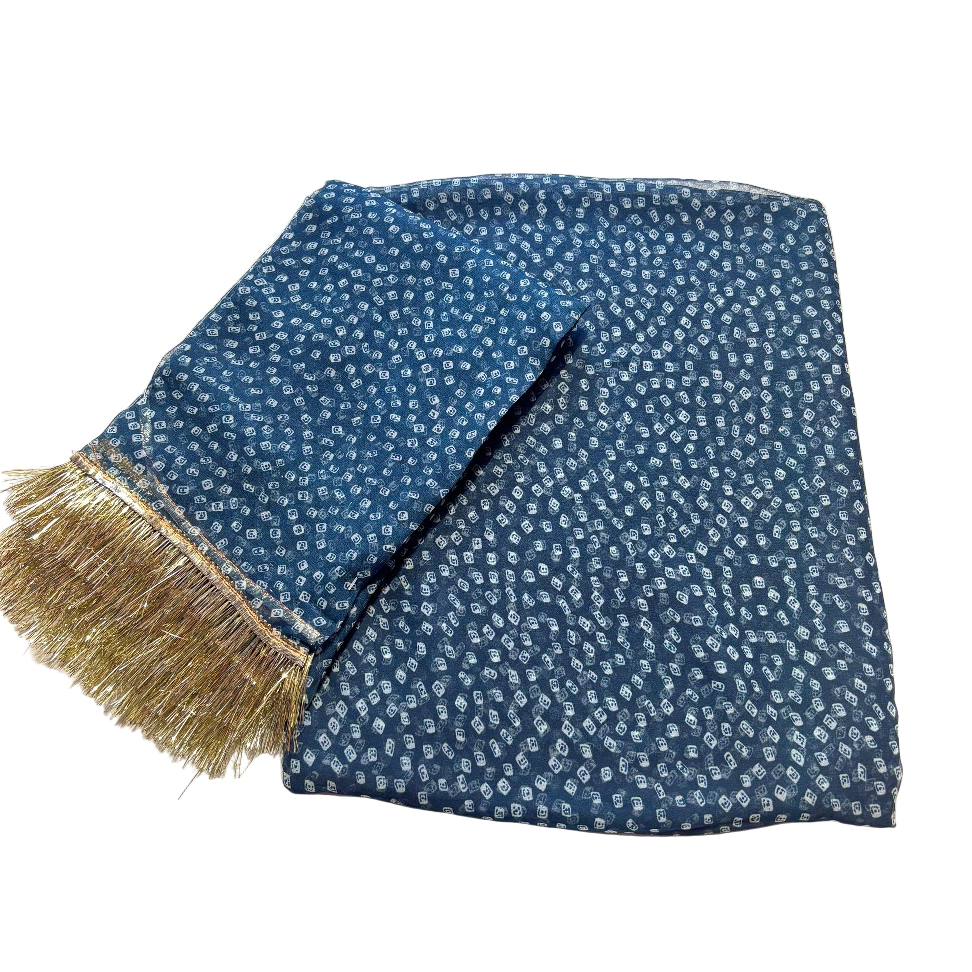 Blue patterned scarf with gold fringe on a white surface