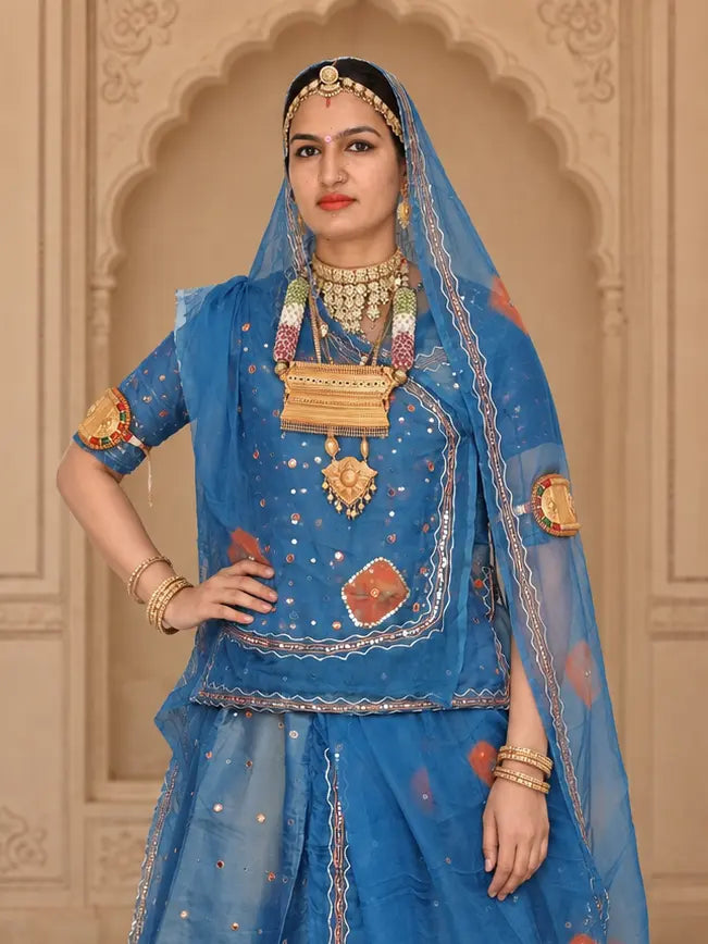 Kurti front with a square mukesh panel, orange centre motif and the odhni over the head