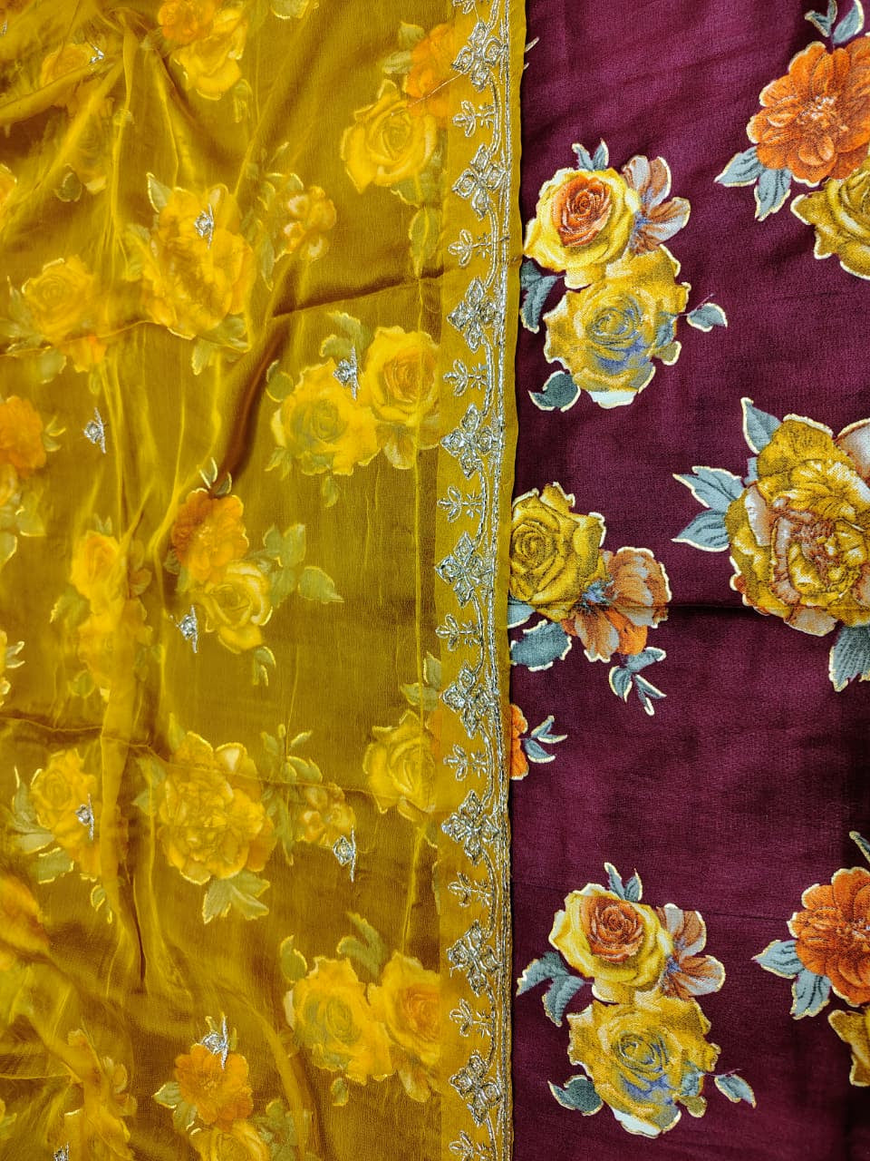 Yellow fabric with floral embroidery on a purple background