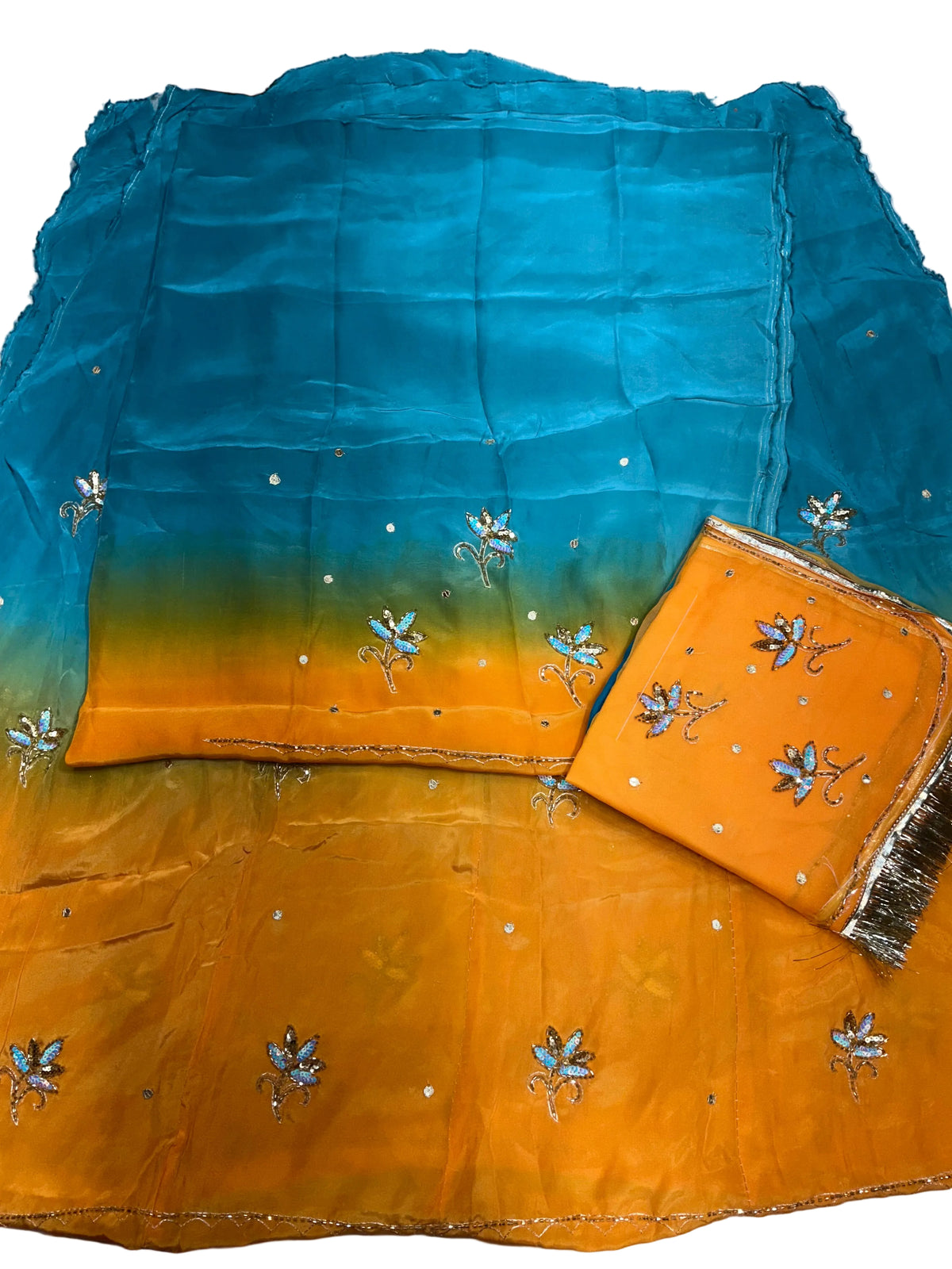 Firozi and orange double shaded Rajputi poshak fabric set with sequin flower butti, folded orange odhni with golden fringe border