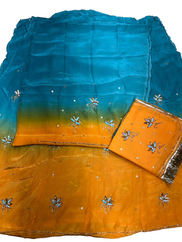 Firozi and orange double shaded Rajputi poshak fabric set with sequin flower butti, folded orange odhni with golden fringe border