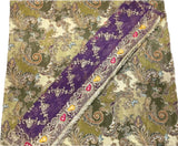 A traditional embroidered fabric, likely an unstitched salwar kameez or dupatta set, featuring a green and beige paisley pattern with a prominent purple border decorated with gold zari embroidery and small red and yellow floral accents.