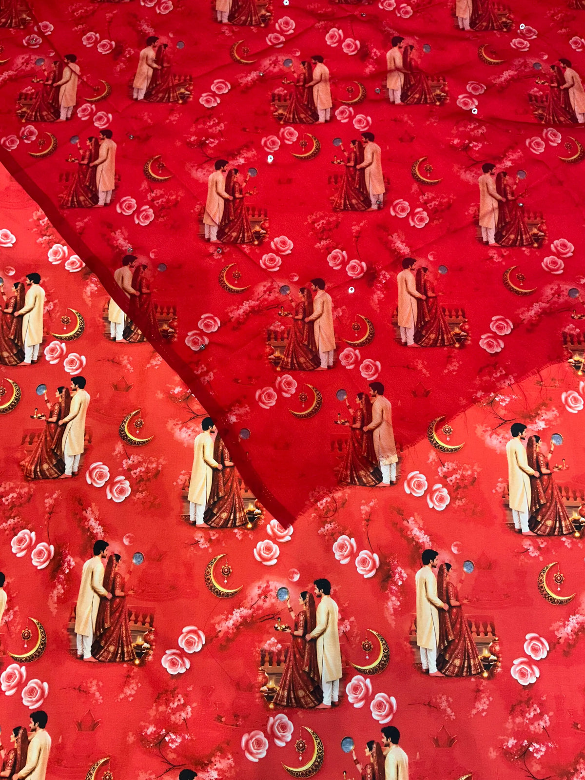 Red Karwa Chauth rajputi poshak fabric with a sheer red Rajan odhni on top, scattered with small silver mukesh tari dots over the couple and moon print