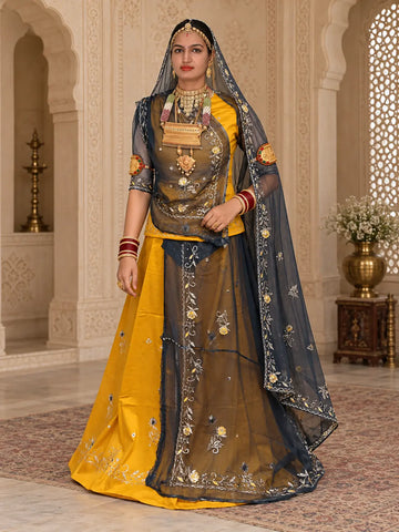 Mustard yellow Rajputi poshak in jaam cotton with a navy blue zari टोरा odhni, front view