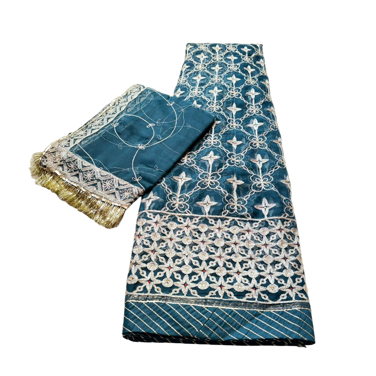 Blue embroidered fabric with white patterns on a beige surface
