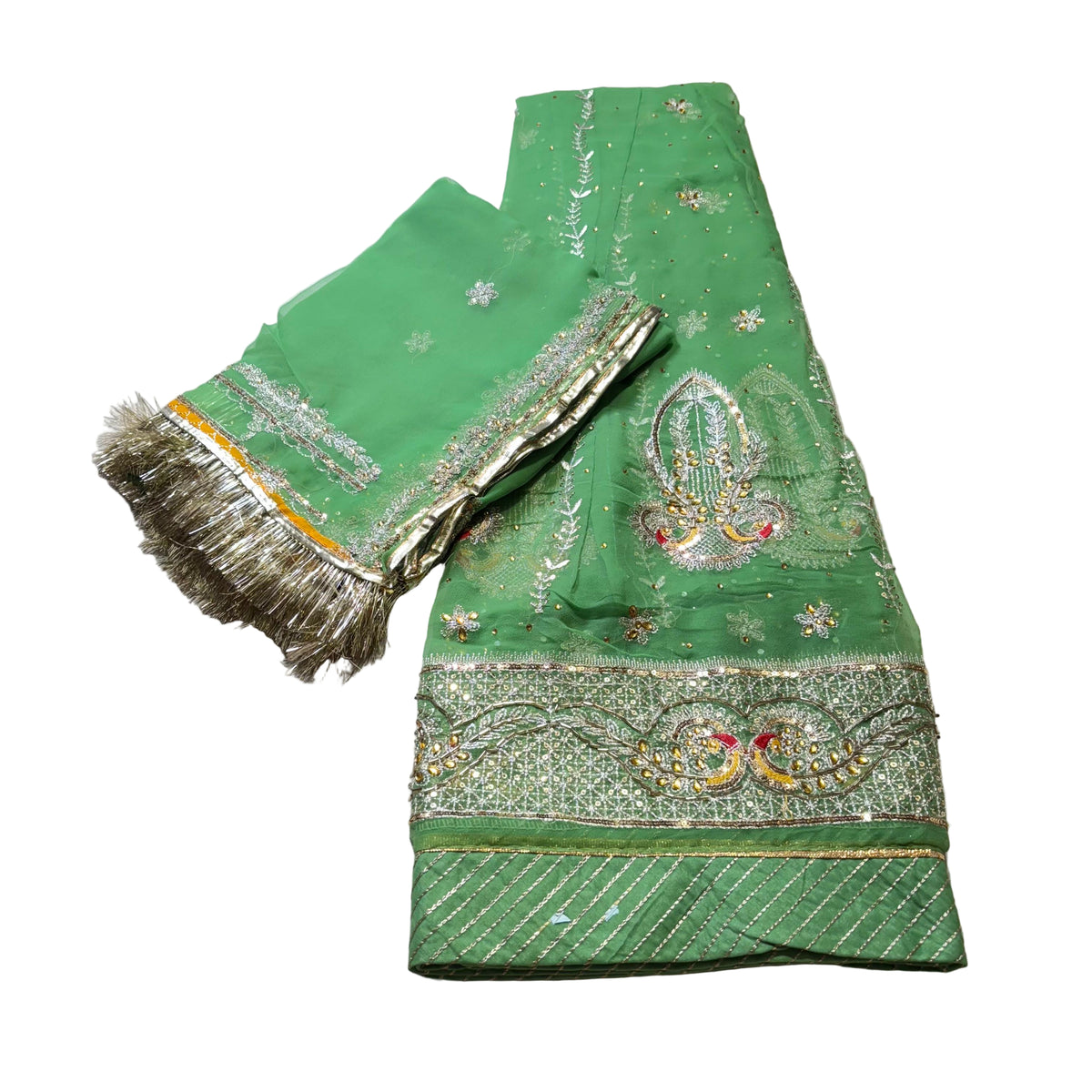 Green embroidered fabric with gold detailing on a light gray background
