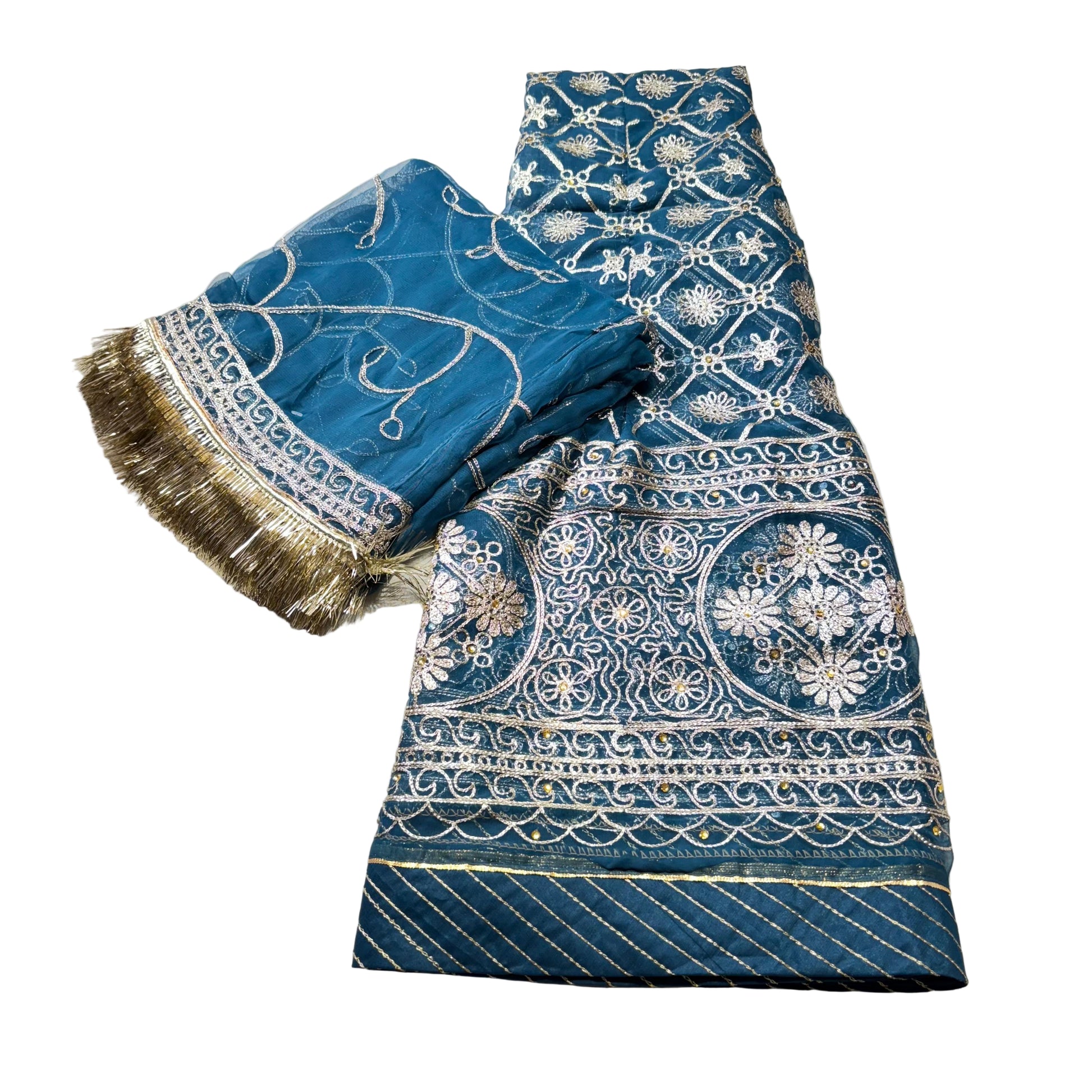 Blue fabric with intricate white patterns on a light gray background