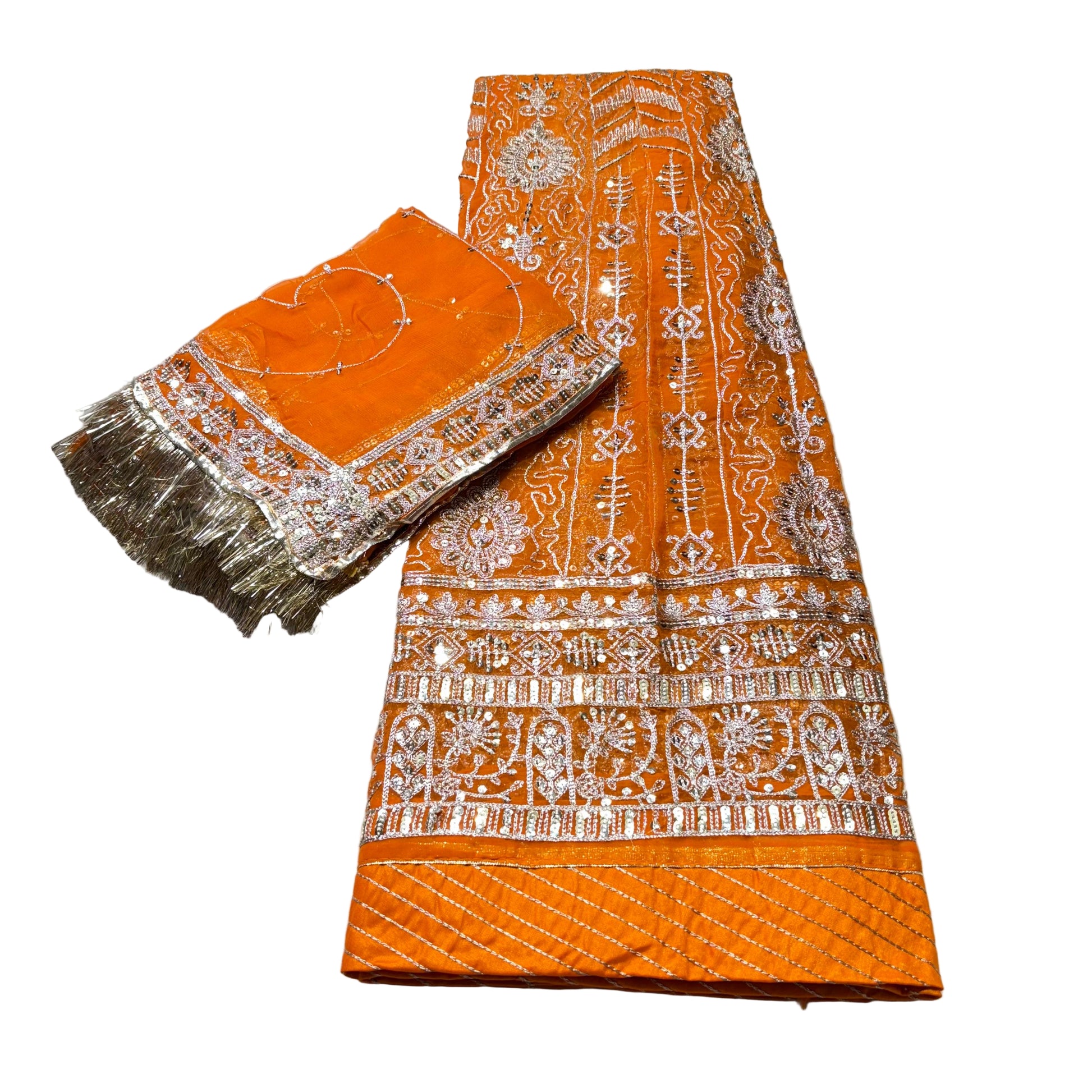 Orange fabric with white embroidery on a light gray background