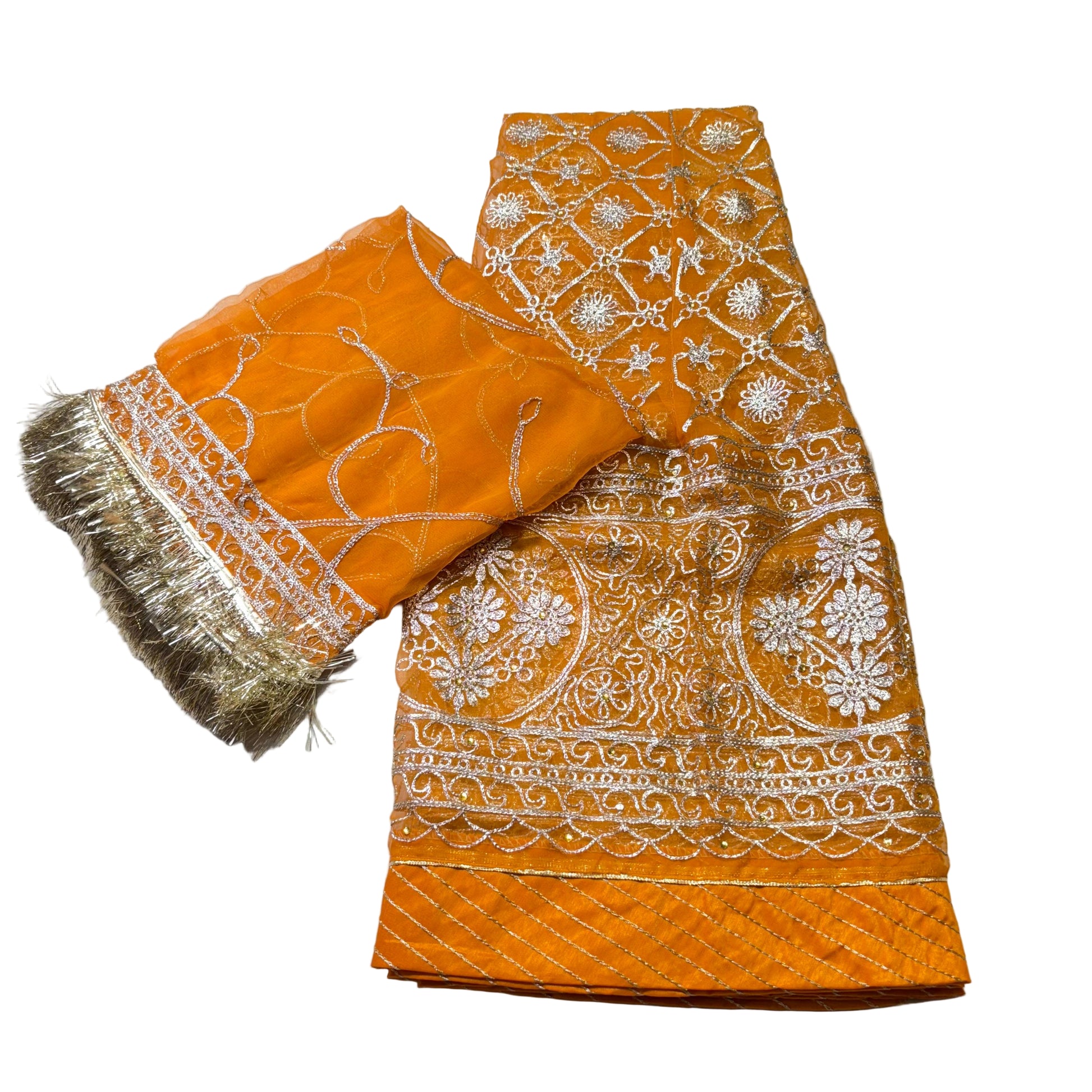 Orange fabric with white embroidery on a light gray background