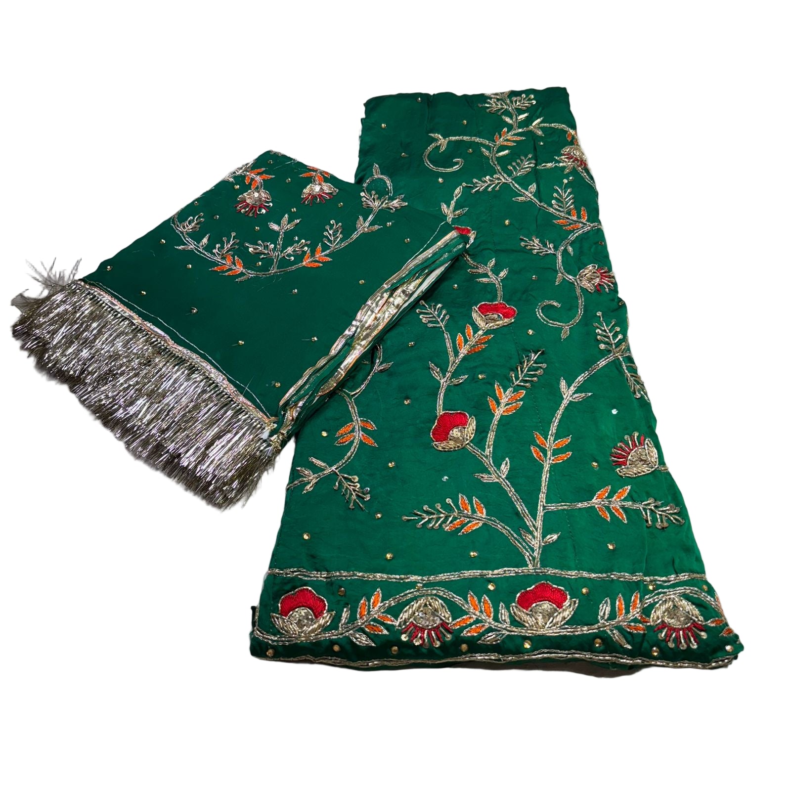 Green embroidered fabric with silver and red details on a white background