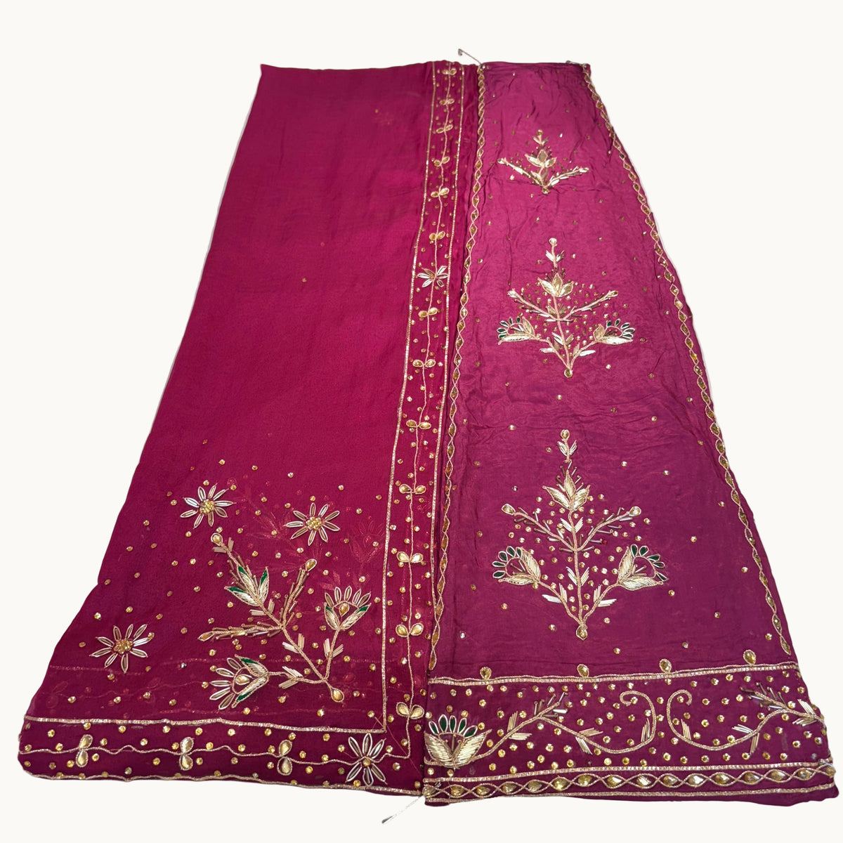 Purple embroidered fabric on a white background