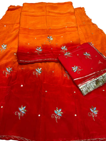 Red orange Rajputi poshak fabric set, orange top shading to red with sequin flower butti, plus a red odhni with golden fringe