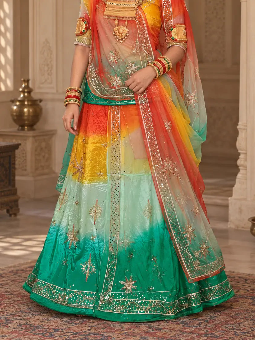 Lehenga close-up with orange, yellow, mint and green bands, zardozi star buttis and wide sequin hem border